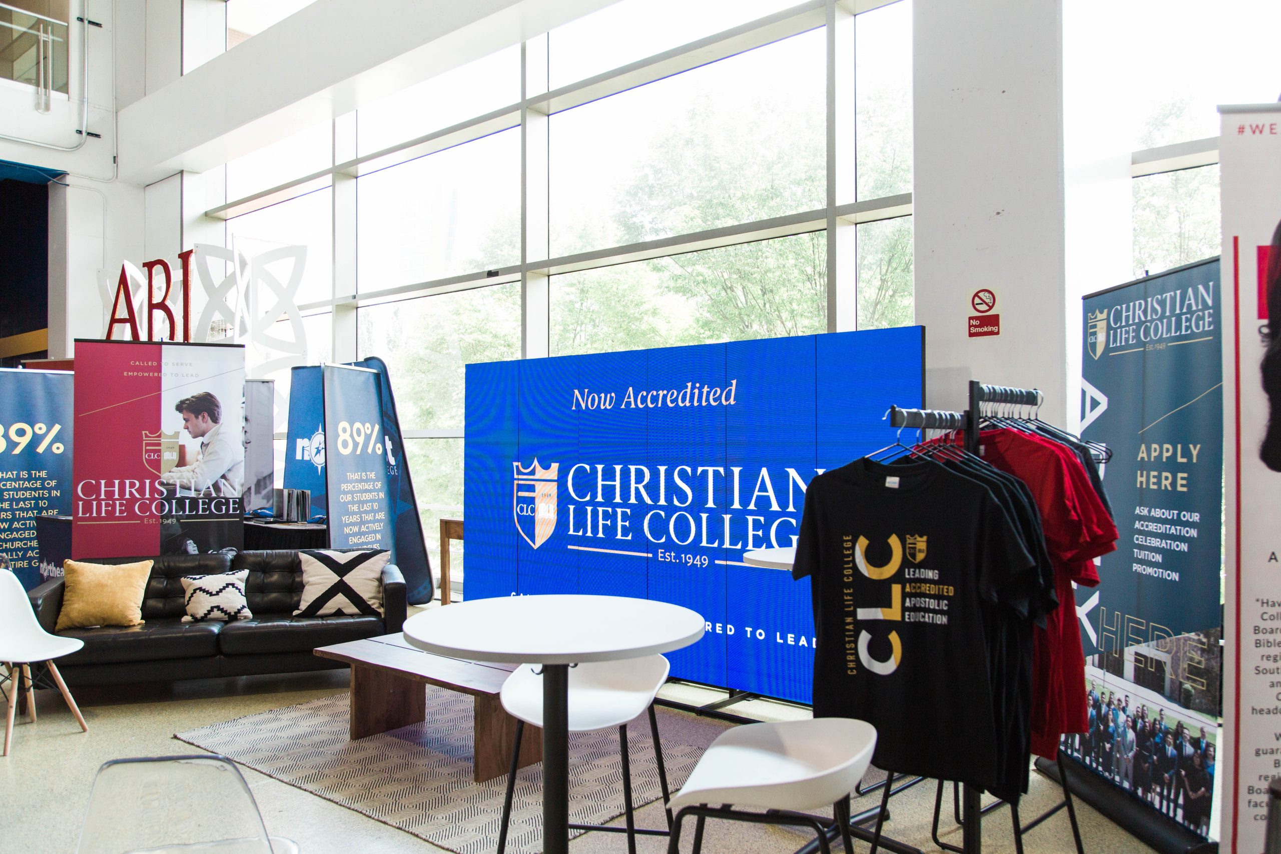 LED screen showing Christian Life College accreditation banner